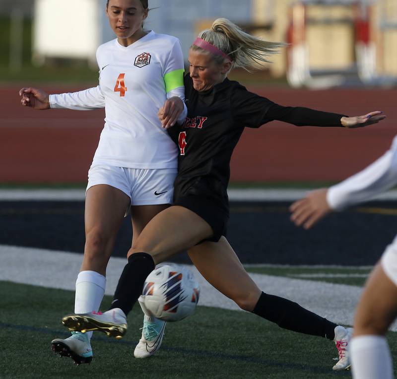 Crystal Lake Central's Hadley Ferrero battles with Huntley's Brooke Maxedon for control of the ball during a Fox Valley Conference  soccer match on Tuesday, April 15, 2025, at Huntley High School.