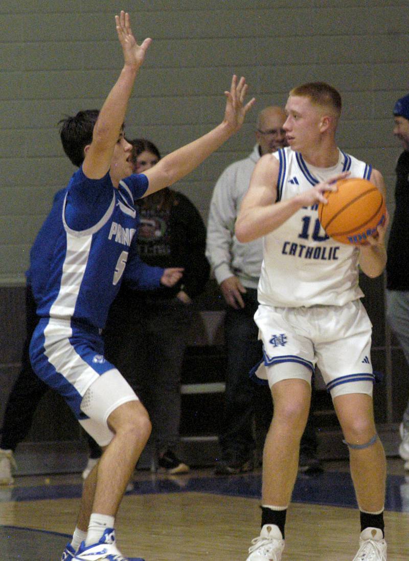 Newman'George Jungerman  looks to get the ball around a defender  . 1-3 Princeton played Newman (3-0) in a conference game. The matchup took place at Newman High School on Friday, December 5, 2025.