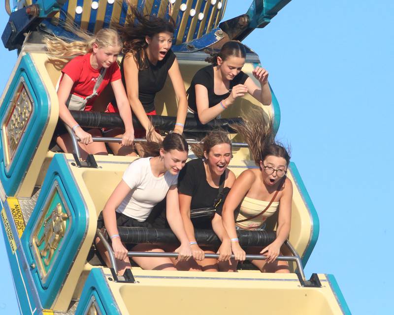 A group of girls enjoy riding Pharaoh's Fury carnival ride during Spring Valley Summerfest on Thursday, June 19, 2025 downtown Spring Valley. The festival features a carnival, live entertainment, food vendors and fireworks on Saturday at dusk.