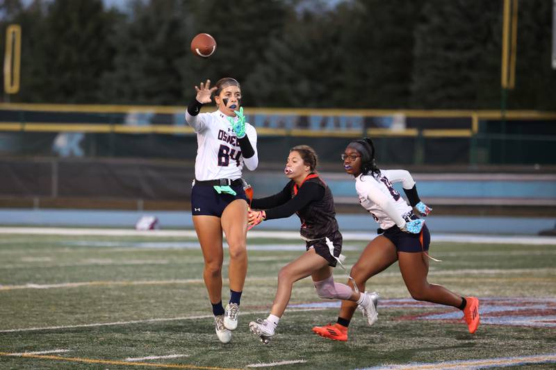Oswego's Sophie Augustine throws the ball before Yorkville's Dani Turner can get the sack during the Foxes' 2-1 overtime victory over Oswego in the IHSA Kankakee Regional championship game on Thursday, Oct. 9, 2025.