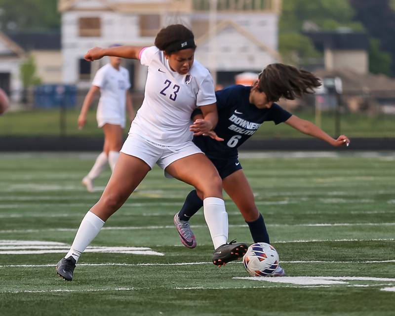 Downers Grove North's Kaitlyn Parker (23) battles Downers Grove South's Nuria Calderon (6) for possession during Class 3A Addison Trail Regional final soccer match between Downers Grove South at Downers Grove North.  May 19, 2023.