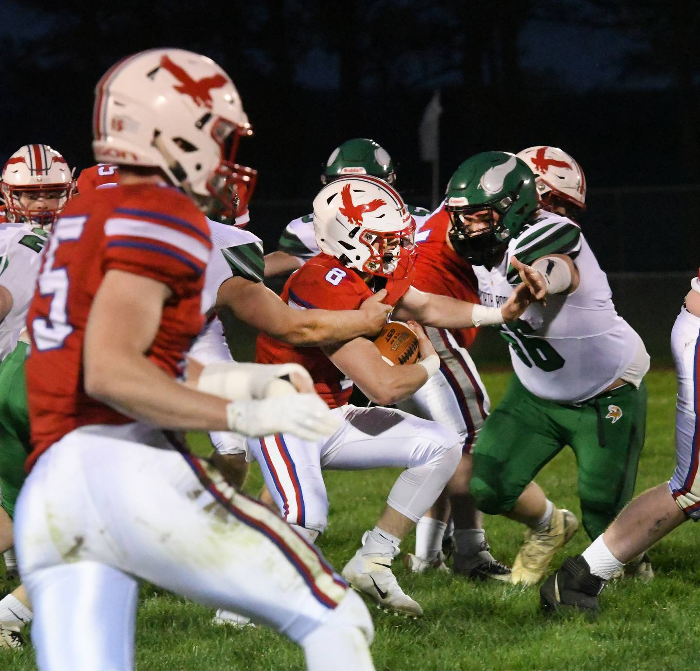 Oregon's Breccan Berns battles for yards against North Boone Friday, April 9, 2021, at Landers Loomis Field.