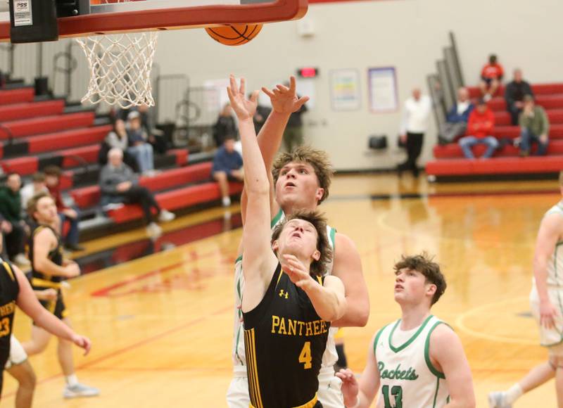 Rock Falls's Austin Castaneda eyes the hoop against Putnam County's AJ Furar during the 50th annual Colmone Classic on Monday, Dec. 9, 2024 at Hall High School.