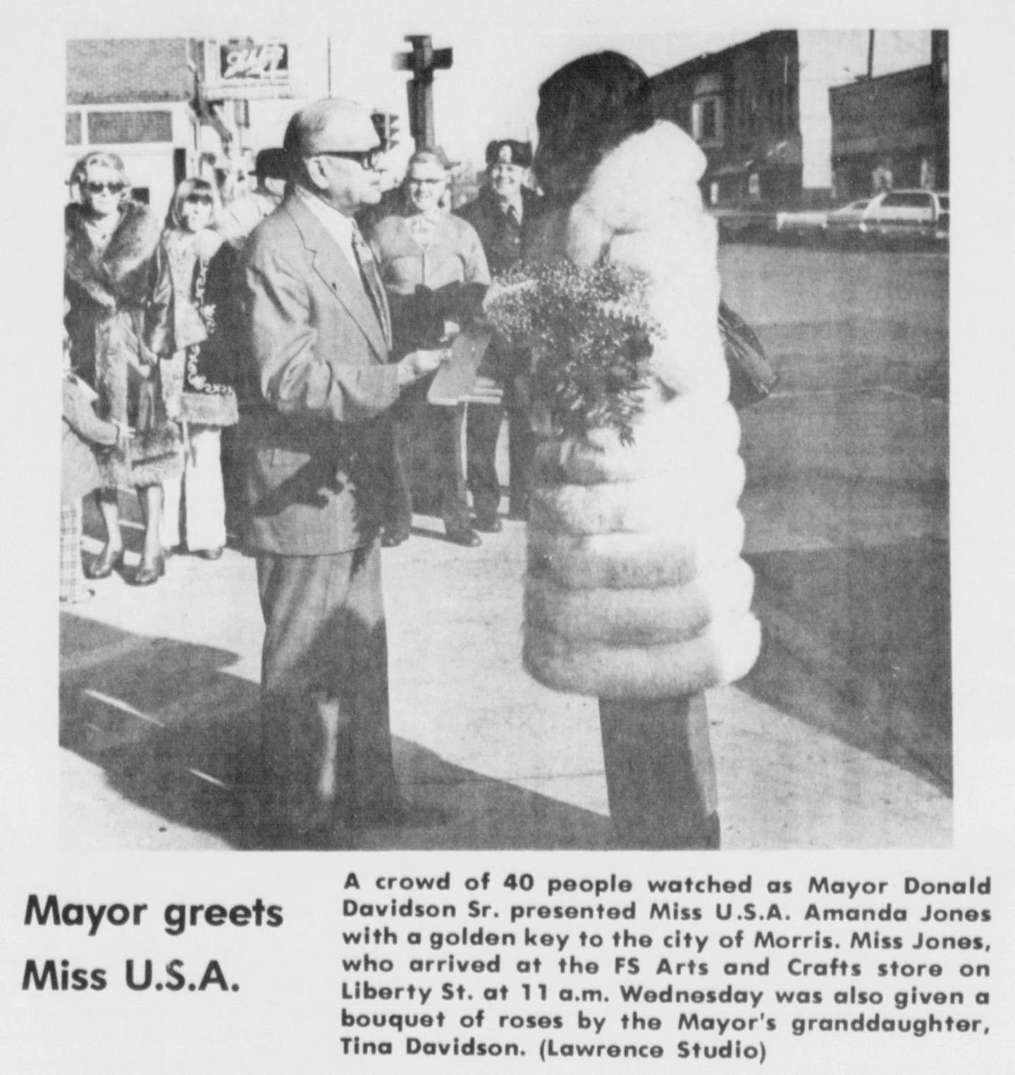 Miss U.S.A., Amanda Jones, greets former Morris Mayor Donald Davidson outside 322 Liberty St.