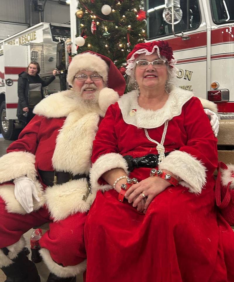Santa and Mrs. Claus pay a visit to the Fulton Fire Department during the annual Breakfast with Santa on Saturday.