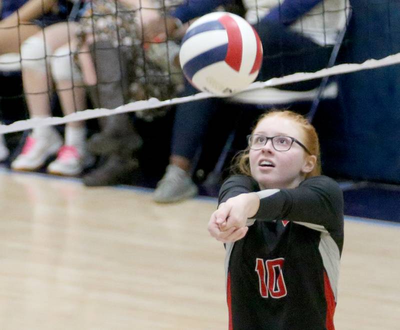 Woodland's Gabby Jacobs hits the ball in the air against Marquette on Thursday, Oct. 19, 2023 at Bader Gym.