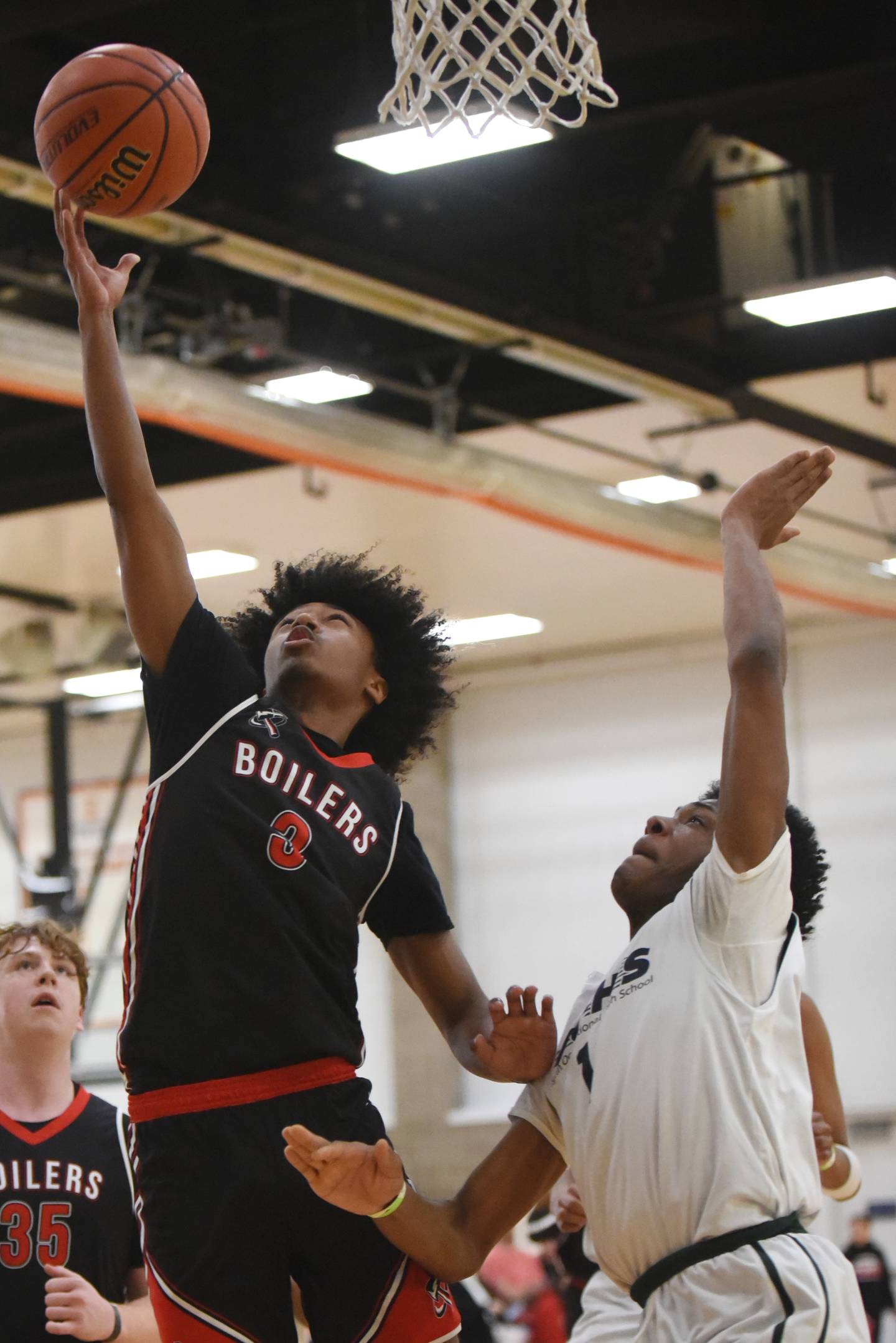 Bradley-Bourbonnais' Josh Jones, left, attempts a layup as Vaughn/St. Patrick's Pierre Brown defends during the IHSA Class 2A Special Olympics Unified State championship at the University of Illinois Activities and Recreation Center Saturday, March 14, 2026.