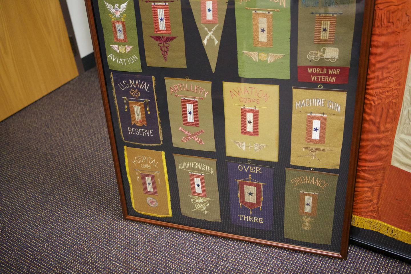 These small service flags from World War I were collected separately and framed together by Mark and Kristine Hutson of Woodstock. They are on display at the Woodstock Public Library through June 3, 2022.