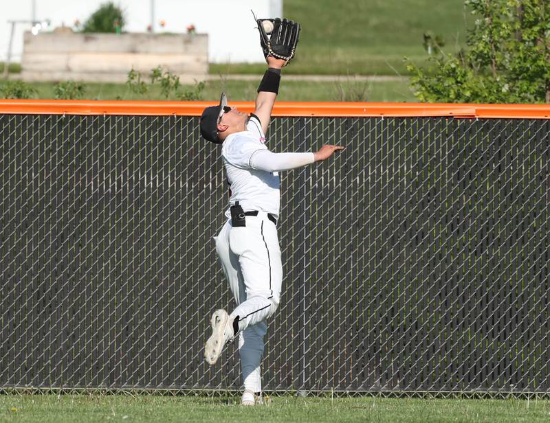 DeKalb’s Paul Kakoliris makes a running catch during their game against Neuqua Valley Tuesday, May 7, 2024, at DeKalb High School.