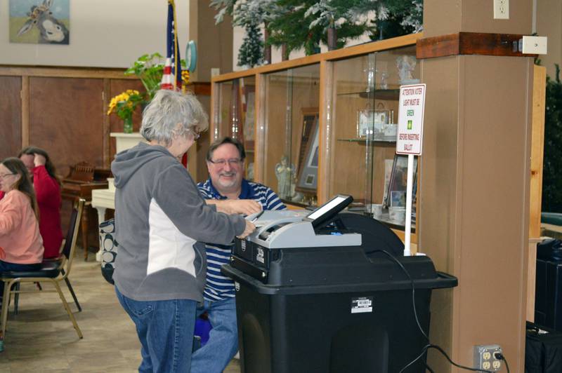 Sandras Wooden submits her ballot for the consolidated election in the Polo Area Senior Center on April 4, 2023. About 173 people had voted in the precinct as of 2:35 p.m.