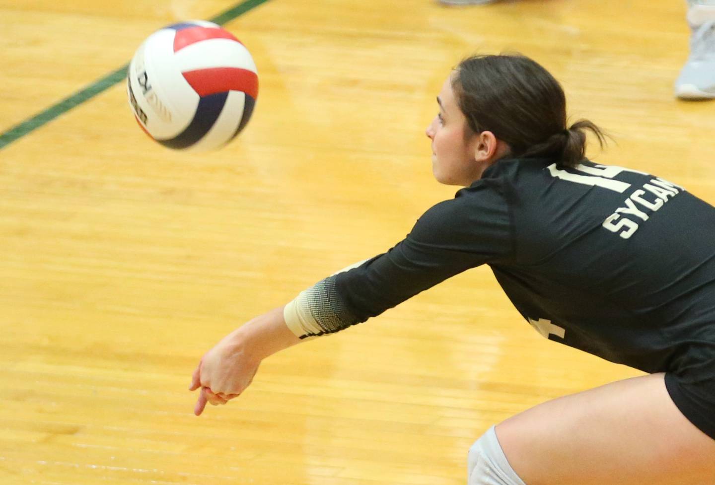 Sycamore's libero Lily Jones returns a serve from L-P on Tuesday, Oct. 15, 2024 in AJ Sellett Gymnasium at L-P High School.