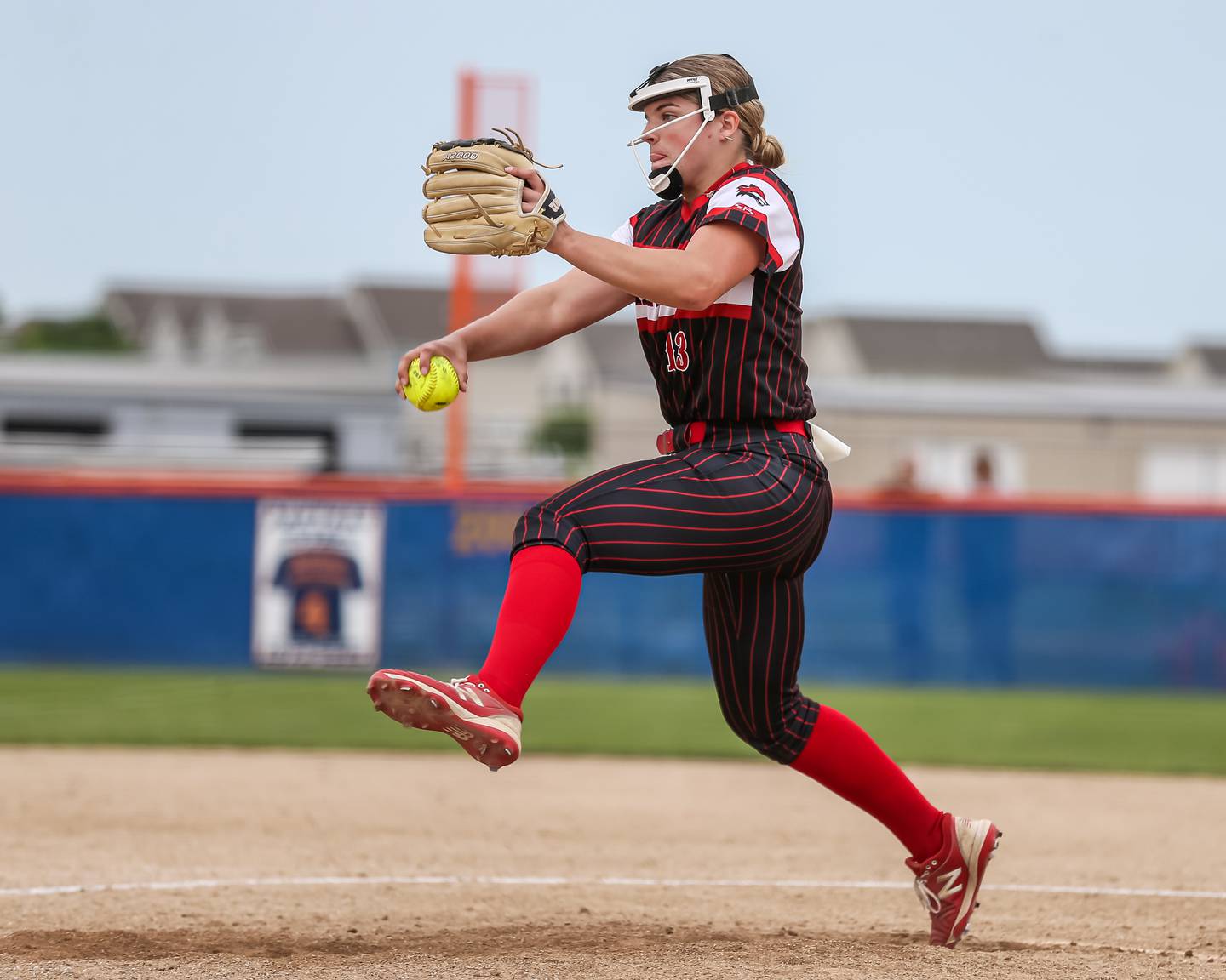 Yorkville's Ellie Fox (13) winds up the delivery to the plate during Class 4A Oswego Regional final softball game between Yorkville at Oswego. May 24th, 2024.