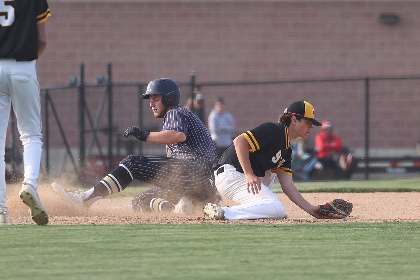 Lemont’s Pat Gardner slides into third ahead of the throw against Hinsdale South on Wednesday, May 24, 2023, in Lemont.