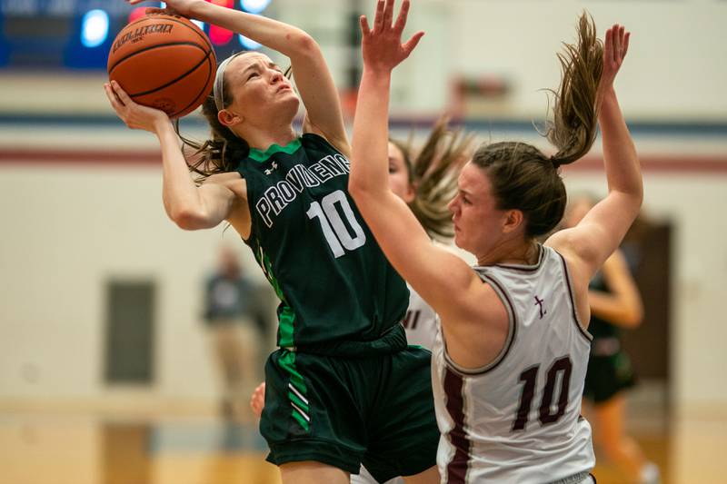 Providence's Molly Knight shoots the ball in the post against Montini’s Maren Hoovel during the 3A Glenbard South Sectional basketball final at Glenbard South High School in Glen Ellyn on Thursday, Feb 23, 2023.