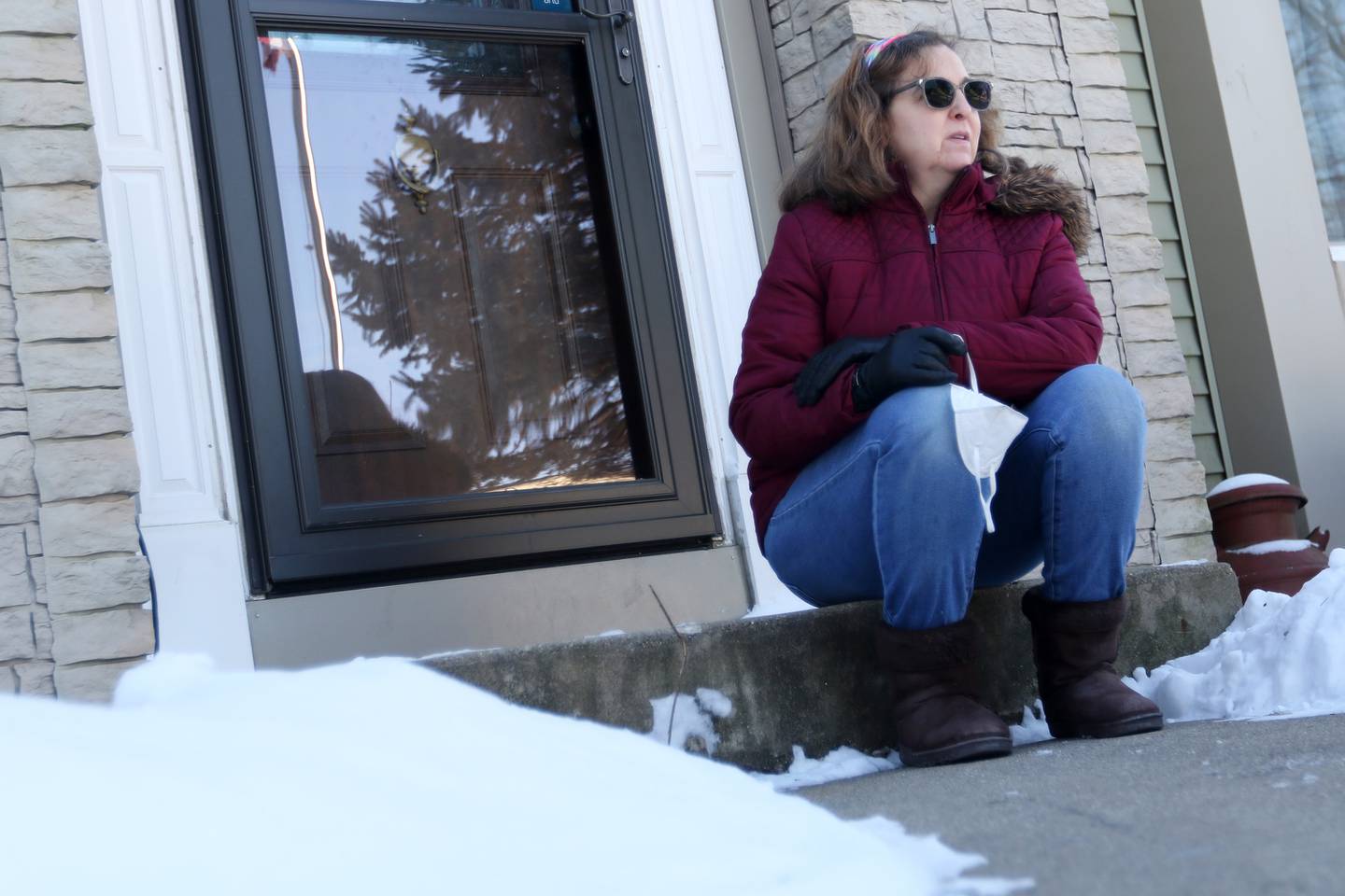 Lisa Keiser of Hebron poses for a portrait outside at home on Thursday, Jan. 28, 2021in Hebron. Keiser is an essential worker in a grocery retail store and is worried about when she will be able to receive a COVID-19 vaccine.  Keiser and her husband are just a few years shy of the 65+ age group that qualifies for the vaccine in Phase 1B.