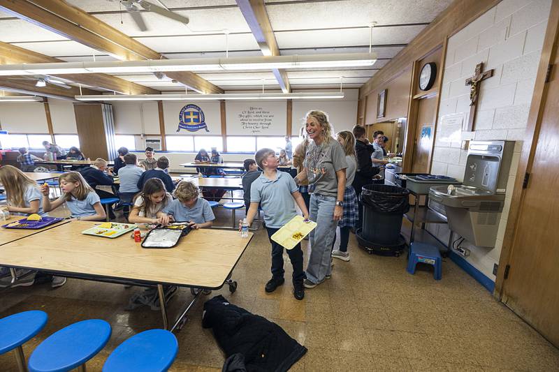 St. Anne’s principal Talarie Bilharz chats with students over lunch Tuesday, March 17, 2026. Bilharz is one of seven Illinois principals up for the Golden Apple award.