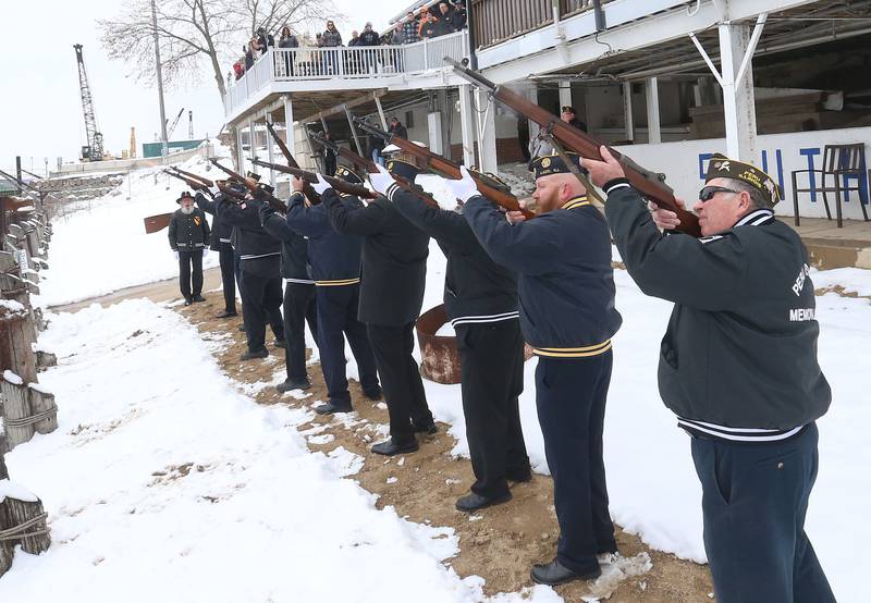 Peru Veterans Memorial Group fireing squad performs a 21 gun salute during the 46th annual Peal Harbor parade and Memorial service at the South Shore Boat Club in Peru.