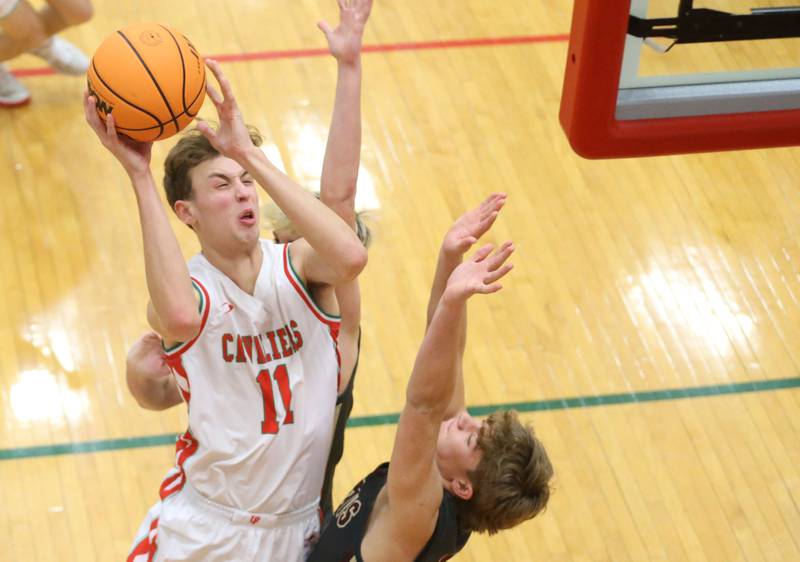L-P's Jameson Hill eyes the hoop as Morris's Caden Medler defends on Monday, Feb. 9, 2026 in Sellett Gymnasium at L-P High School.