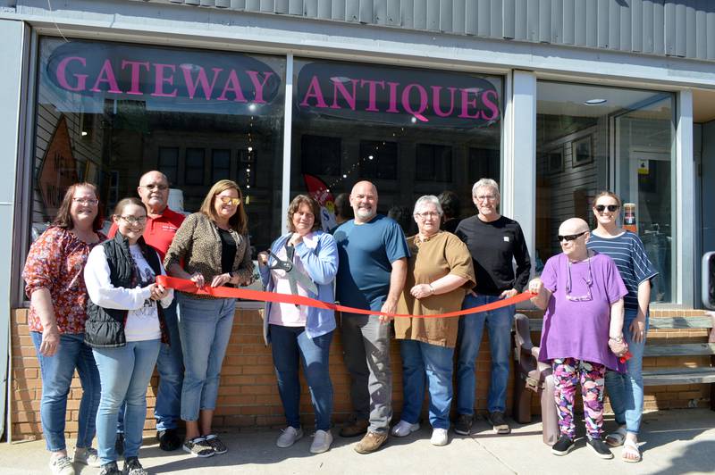 Two connected Polo businesses — Gateway Big Box Resale and Kim's Gateway Antiques — celebrated their one-year anniversaries on April 28, 2023, with a ribbon-cutting. Left to right are First State Bank Branch Manager Pam White; Polo City Clerk Sydney Bartelt; Polo Mayor Doug Knapp; Polo Chamber of Commerce Vice President Tamela Merdian; co-owners Jodi Horner and Shannan Haenitsch; store employee Sheala Wells; Mike Scholl; Vy Echelbarger, mother of Haenitsch; and Chamber Secretary Megan White.