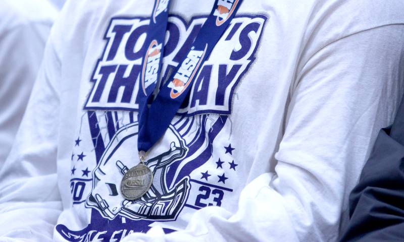 Players donned their medallions and matching shirts during a celebration of the IHSA Class 6A Cary-Grove football team at the high school Sunday.