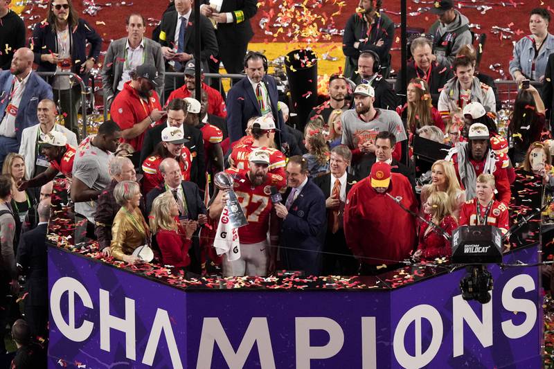 Kansas City Chiefs tight end Travis Kelce (87) holds the Vince Lombardi Trophy after the team's victory over the San Francisco 49ers in the NFL Super Bowl 58 football game Sunday, Feb. 11, 2024, in Las Vegas. (AP Photo/David J. Phillip)
