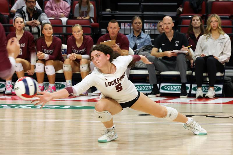 Lockport's Emma Consigny reaches for a dig during Benet Academy's victory in two sets, 25-23, 25-16, over Lockport in the IHSA Class 4A State semifinals on Friday, Nov. 14, 2025.