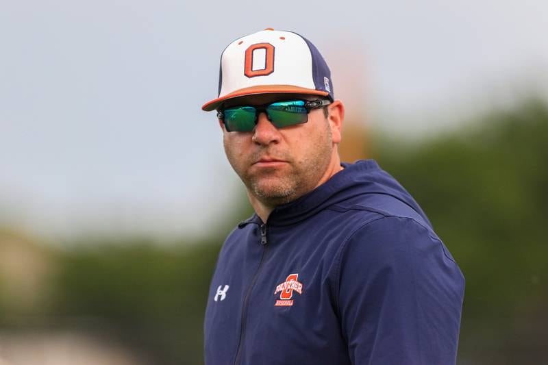 Oswego's head coach Joe Giarrante walks to the coaches box during Class 4A Romeoville Sectional semifinal game between Plainfield North at Oswego.  June 1, 2023.