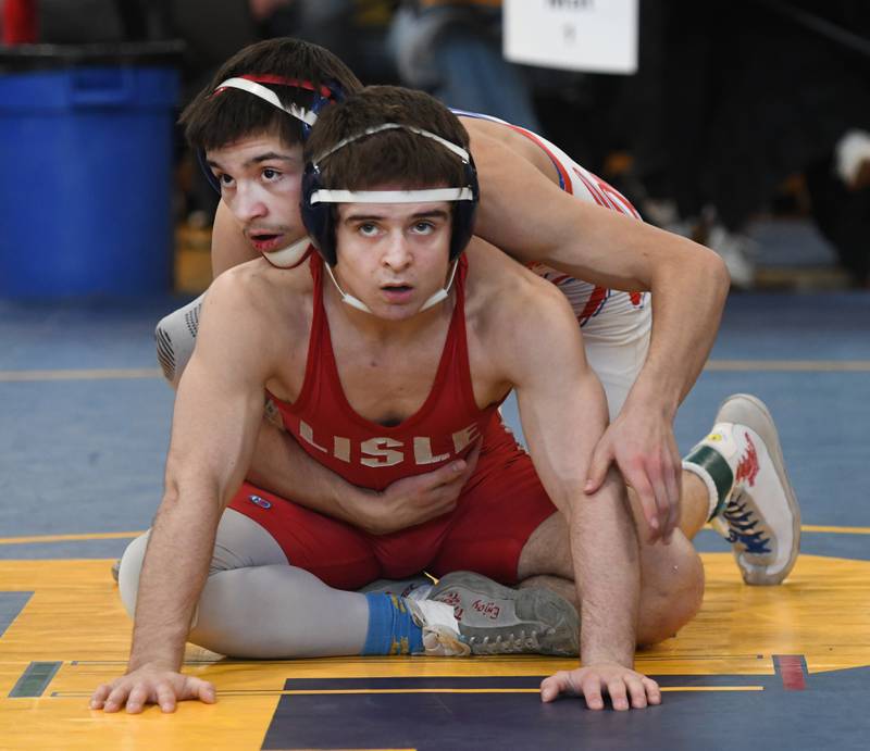 Oregon's Isaiah Perez (top) and Lisle's Alexander Ferari wait for the referee's signal at the start of one of their rounds in the 126-pound championship match at the Polo Wrestling Invitational on Saturday, Jan, 10, 2026 at Polo High School.