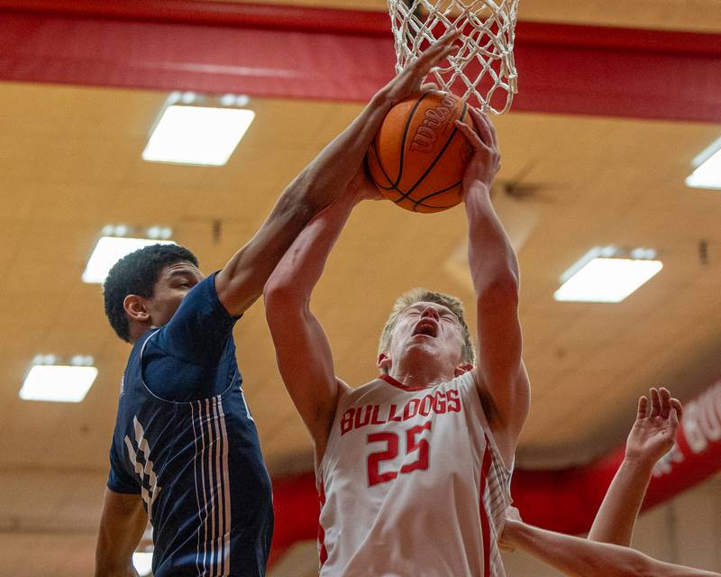 Joseph Hoekstra (25) of Streator lays up ball as Lisle's David Nesbitt (11) attempts to block shot on Wednesday, Feb. 18, 2026 at Streator High School in Streator.