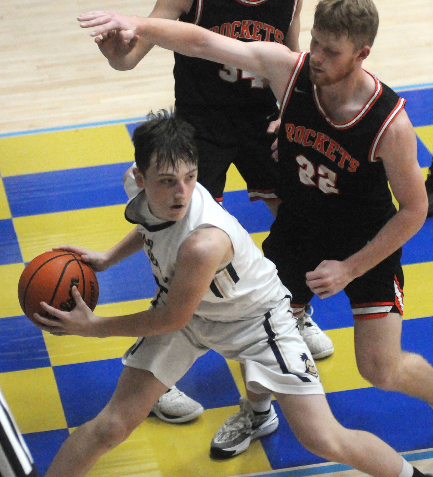 Marquette's Griffin Dobberstein looks outside as Roanoke-Benson's Nolan Hunter defends at Bader Gymnasium on Friday, Dec. 15, 2023.
