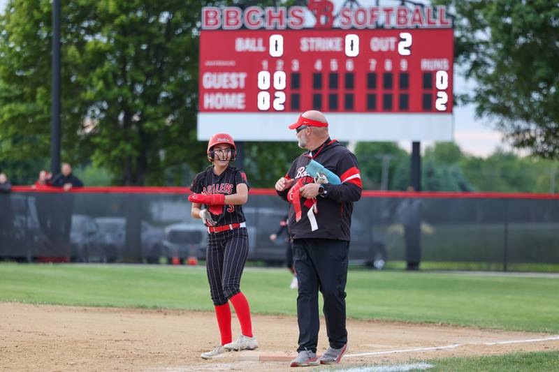 Bradley-Bourbonnais’ Bella Pusateri smiles after reaching first base during the Boilermakers' 8-0 victory over Normal Community in the IHSA Class 4A Bradley-Bourbonnais Regional semifinal on Tuesday, May, 27, 2025.