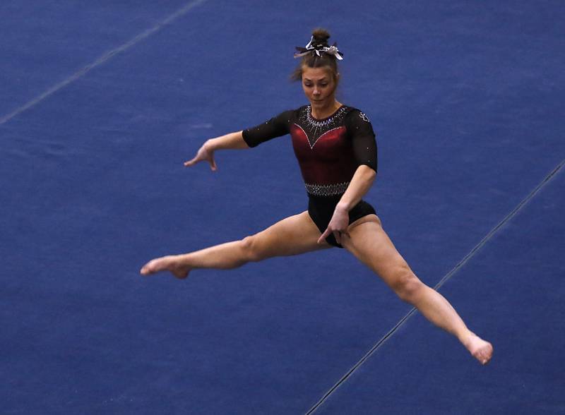 Prairie Ridge's Gabby Riley competes in the Friday, Feb. 17, 2023, during the IHSA Girls State Final Gymnastics Meet at Palatine High School.