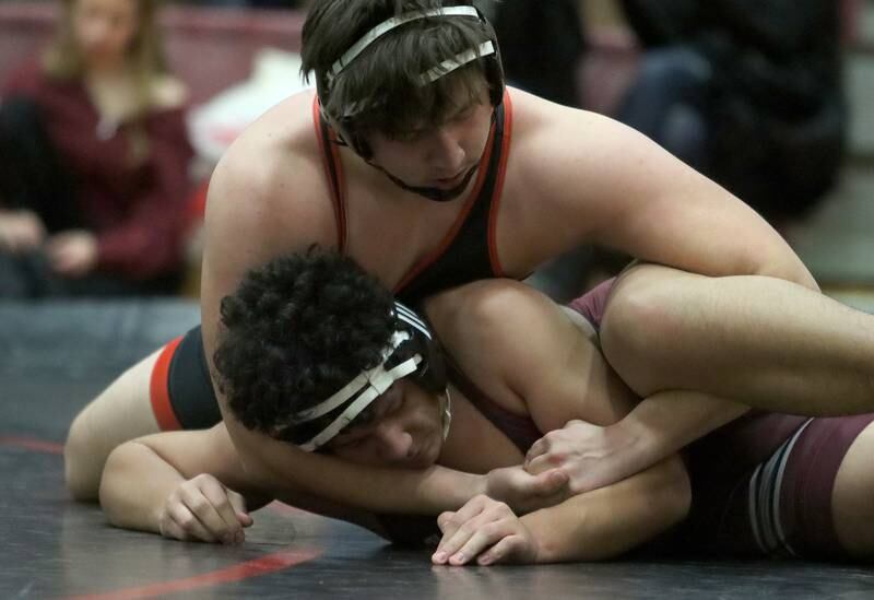Huntley’s Mason Maldonado, top, battles Prairie Ridge’s Maximo Martinez at 285 pounds in varsity wrestling on Thursday, Jan. 23, 2025, at Huntley High School in Huntley.