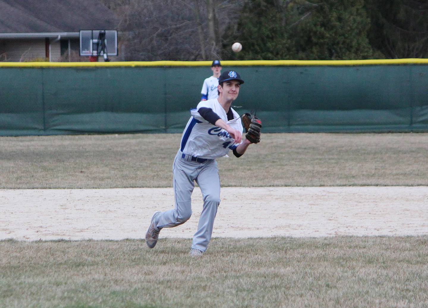 Newman's Kyle Wolfe throws to first base for an out against Kewanee on Thursday, March 30, 2023 during their Three Rivers East game in Sterling.