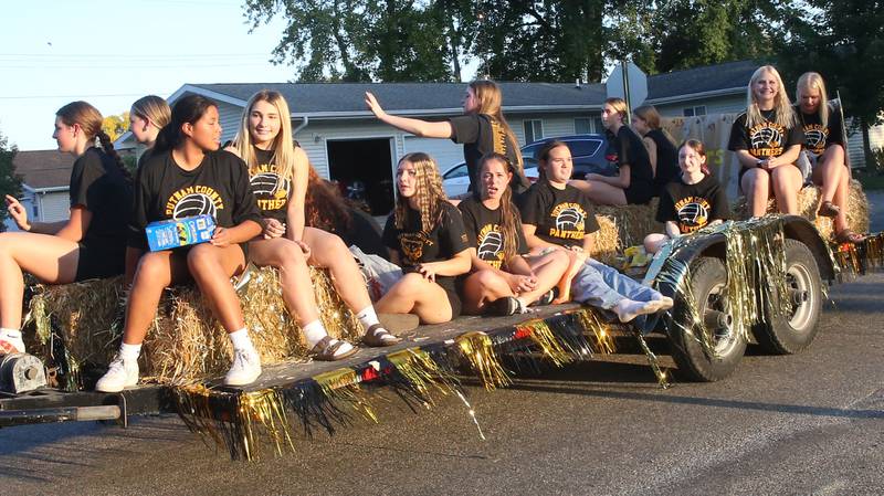 The Putnam County High School volleyball team rides a float during the inaugural Homecoming parade on Wednesday, Sept. 17, 2025 down Elm Street in Granville.