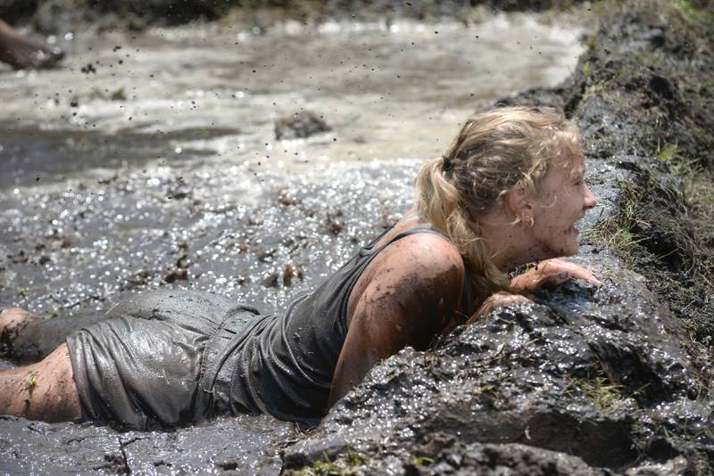 Shelby Hodgett of Prophetstown, dives for a ball during a mud volleyball game at Hooppole Fun Day on Saturday, June 28, 2025 in Hooppole.