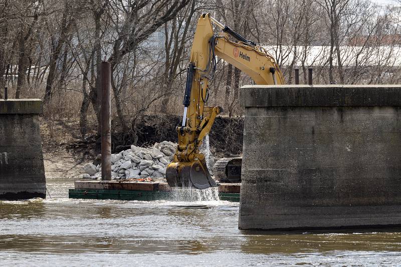 Workers dig into the Rock River Wednesday, March 26, 2025, as Project Rock continues.