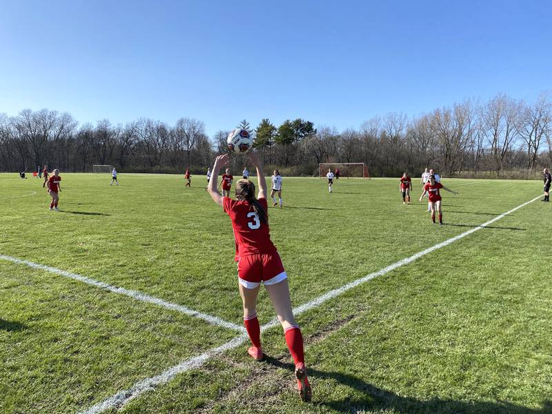 Streator freshman Joey Puetz (3) inbounds the ball from the east sideline Thursday, April 21, 2022, during the Bulldogs' penalty-shootout loss to Reed-Custer at the Streator Family YMCA.