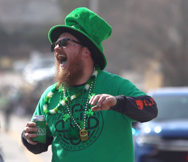 Joe Koschalk of McHenry shares a laugh with others as he waits for the start of the ShamROCKS the Fox Parade in McHenry on Saturday, March 15, 2025.