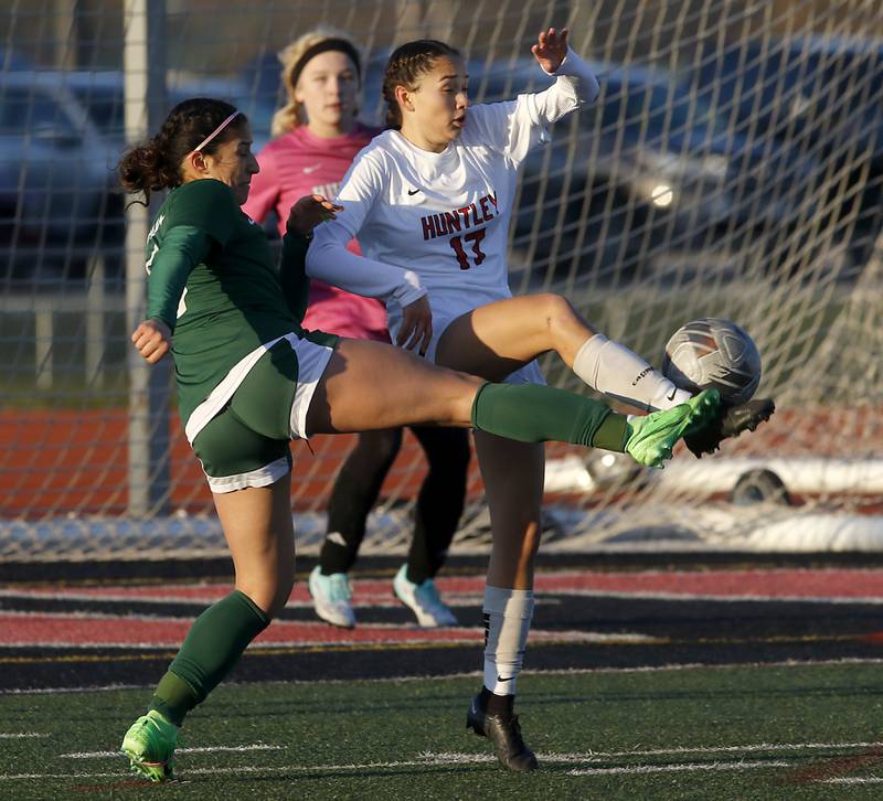 Huntley's Itzel Martinez kicks the ball away from Boylan Catholic's Sofia Cazares during a nonconference soccer game on Wednesday, March 27, 2024, at Huntley High School.