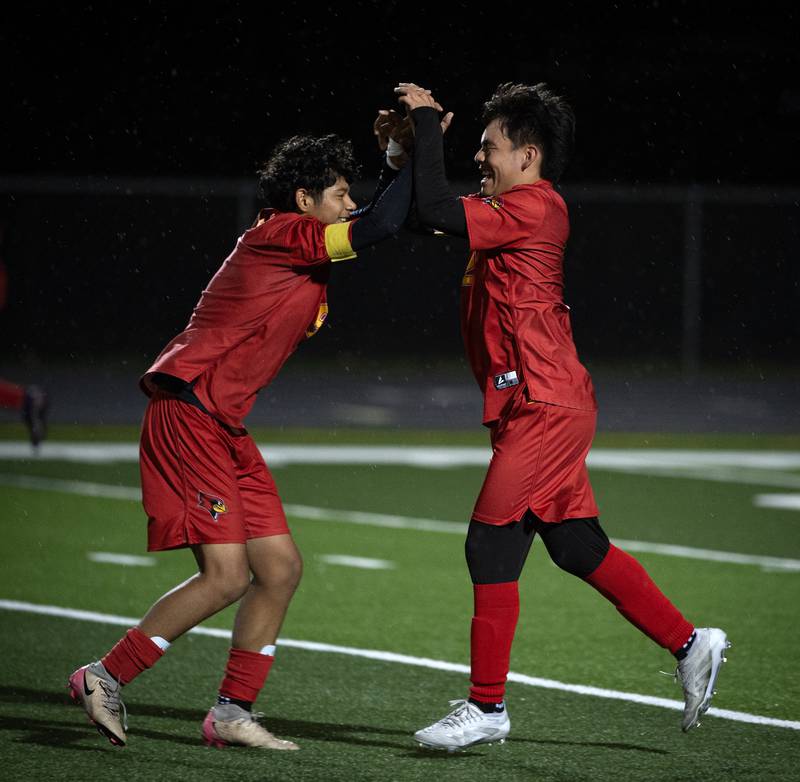 St. Anne's Erick Franco, right, celebrates his goal with teammate Joshua Hernandez, left, in a regional match-up against Clifton Central on Tuesday, October 21, 2025.