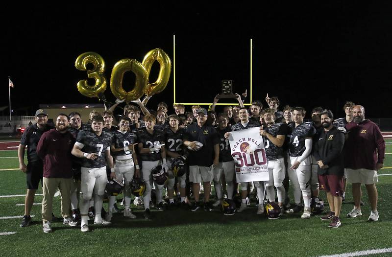 Richmond-Burton Head Coach Mike Noll is surround by players and coaches after Noll won his 300 game on Friday, Oct. 17, 2025, at Richmond-Burton High School in Richmond.