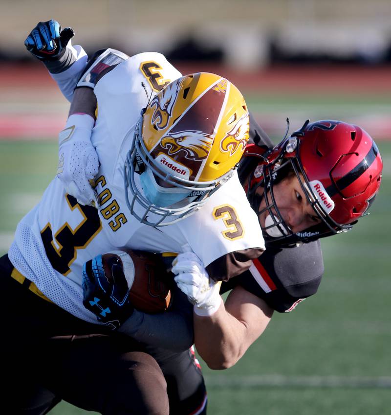 Huntley's Christopher Medina, left, hits Jacobs' Jaiden LaRoss, taking him out of bounds during their season opening football game at Huntley High School on Friday, March 19, 2021 in Huntley.