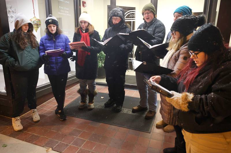 Members of the Sycamore High School Jazz Choir sing carols for visitors Friday, Nov. 18, 2022, during the Sycamore Chamber of Commerce's annual Moonlight Magic event in downtown Sycamore.