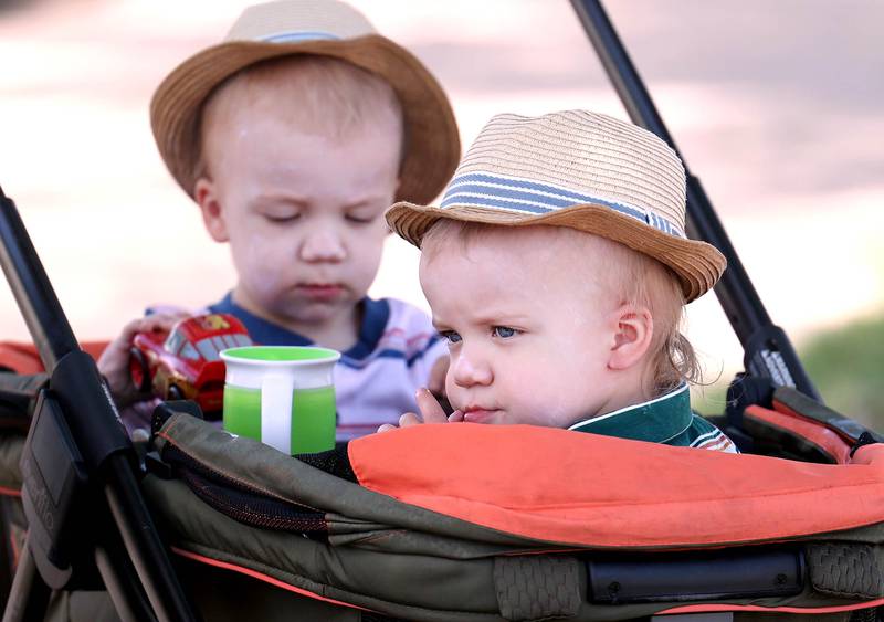 Twins Pierce and Rowan Ellison, 1, from Cortland, get ready to watch the Sycamore Memorial Day parade Monday, May 29, 2023.