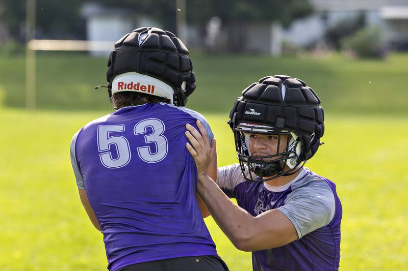 Dixon players run through drills Monday, August 11, 2025, for the first day of football practice.