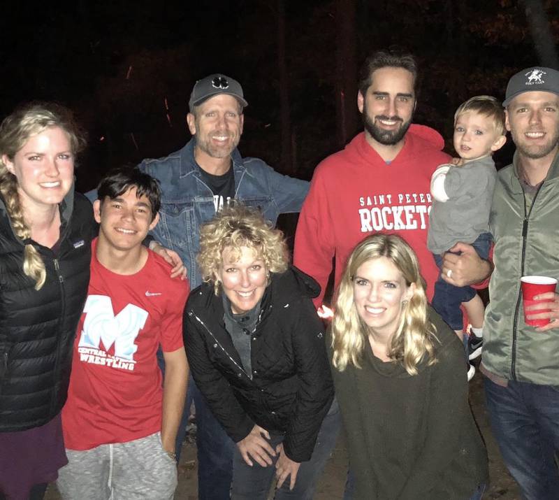 Cheryl and Gary stand with their family. In the back row are Cheryl's daughter Janelle (from left), Gary, Cheryl's son-in-law Gabe holding Lincoln and Cheryl's son Austin. In the front row are Cheryl's son Nikita (from left to right), Cheryl and Cheryl's daughter Jordain.