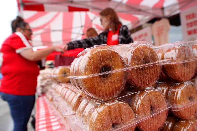 People purchase apple cider donuts during the Johnny Appleseed Festival in downtown Crystal Lake on Saturday Sept. 28, 2024, in Crystal Lake.