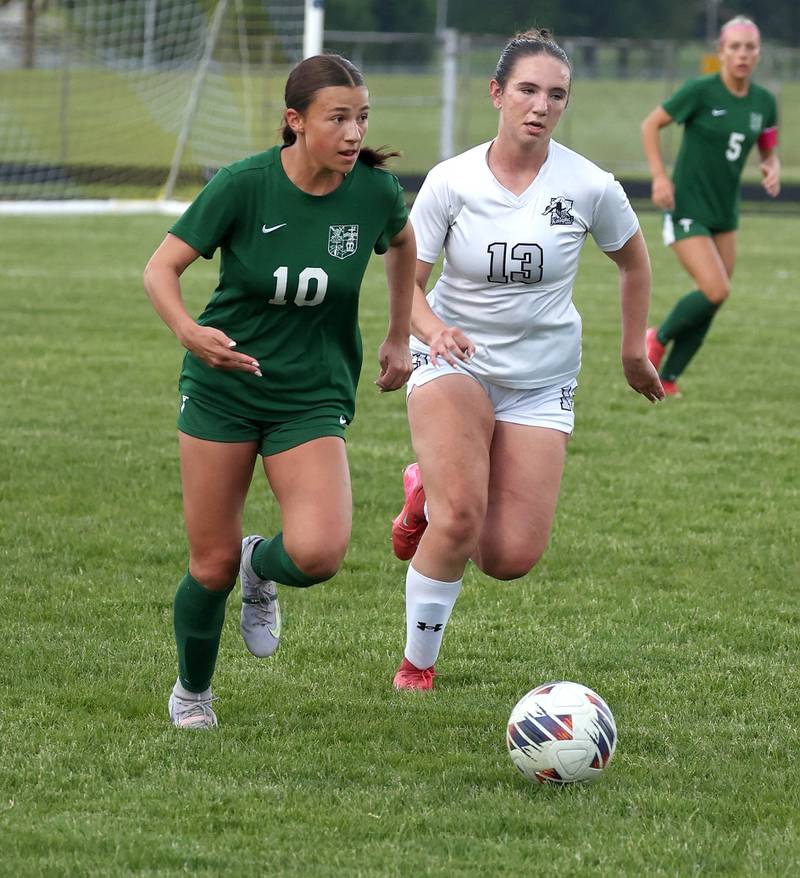 Kaneland's Kyra Lilly (right) and Boylan's Ava Galluzzo chase after the ball Wednesday, May 28, 2025, during their Class 2A sectional semifinal game at Belvidere High School.