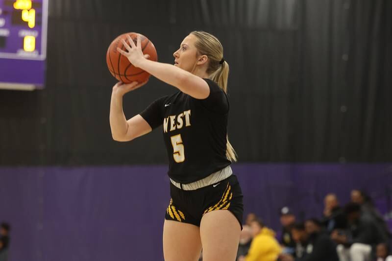 Joliet West’s Ingrid Troha takes the three point shot against Joliet Catholic in the 2023 WJOL Girls Basketball Tournament on Friday, Nov. 17, 2023, in Joliet